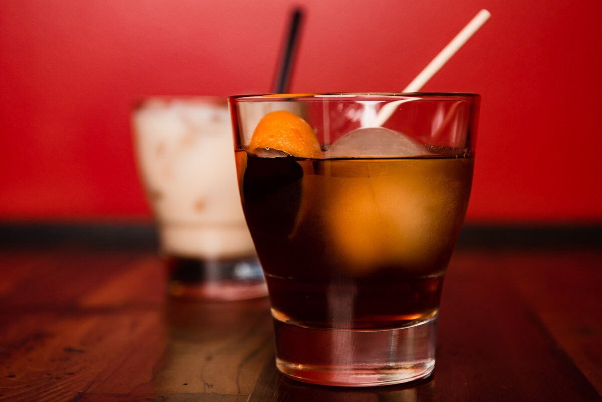 A smoked old fashioned on the bar at Nona Social